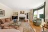 Family room with a wood burning fireplace