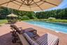 Enjoy sitting under an umbrella enjoying a good book in paradise