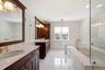 cherry cabinetry with marble countertops