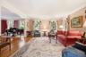 Large windows with wood inlaid floors