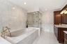 Primary bath with separate jacuzzi tub and steam shower.