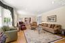 Family room with sunny bay window overlooking the deck.