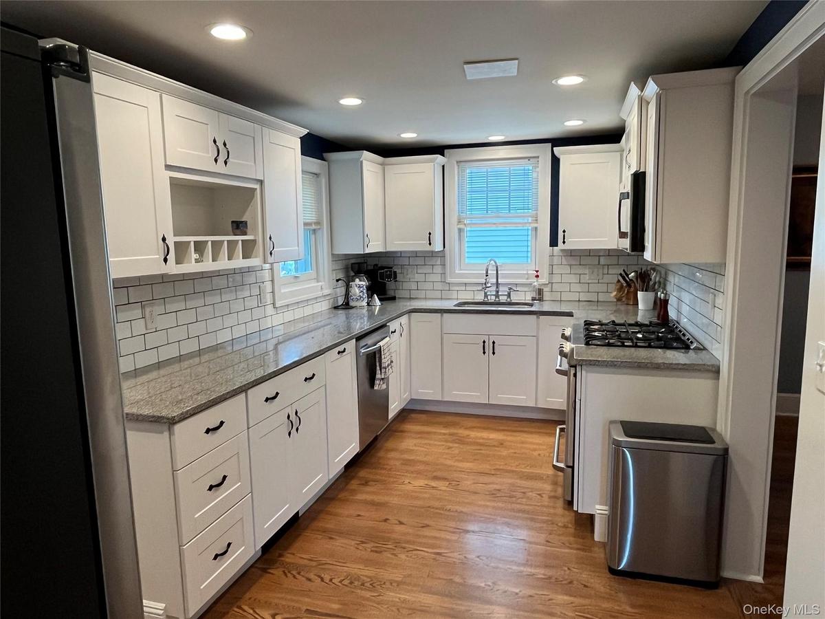 Kitchen with Stainless Steel Appliance, Crown Molding , and Granite Counters