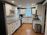 Kitchen with Stainless Steel Appliance, Crown Molding , and Granite Counters