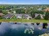 Aerial view of pond and home