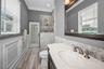 Pool bathroom w/custom cabinetry and glass walk-in shower