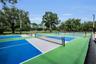 New fenced in pickleball courts at Commons Park