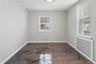 Room featuring a contemporary metallic epoxy floor, neutral painted walls, and white baseboards