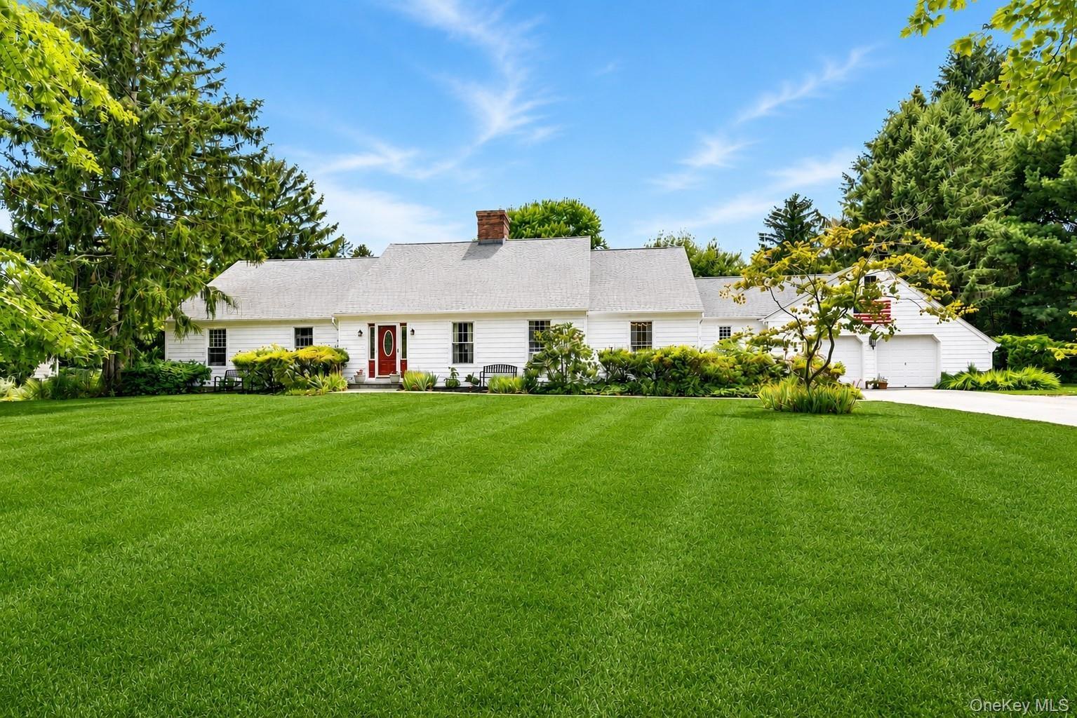 Classic and inviting front exterior welcomes you with timeless curb appeal, mature landscaping and a picturesque setting overlooking the golf course. 