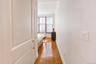 Entrance to bedroom with walk in closet