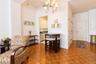 Another view from the living room showing entry to apartment and entry to kitchen
