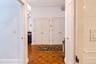 Showing 2 entry closets from hallway