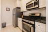Kitchen with gas range, microwave, refrigerator, dishwasher