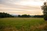 Yard at dusk featuring a rural view
