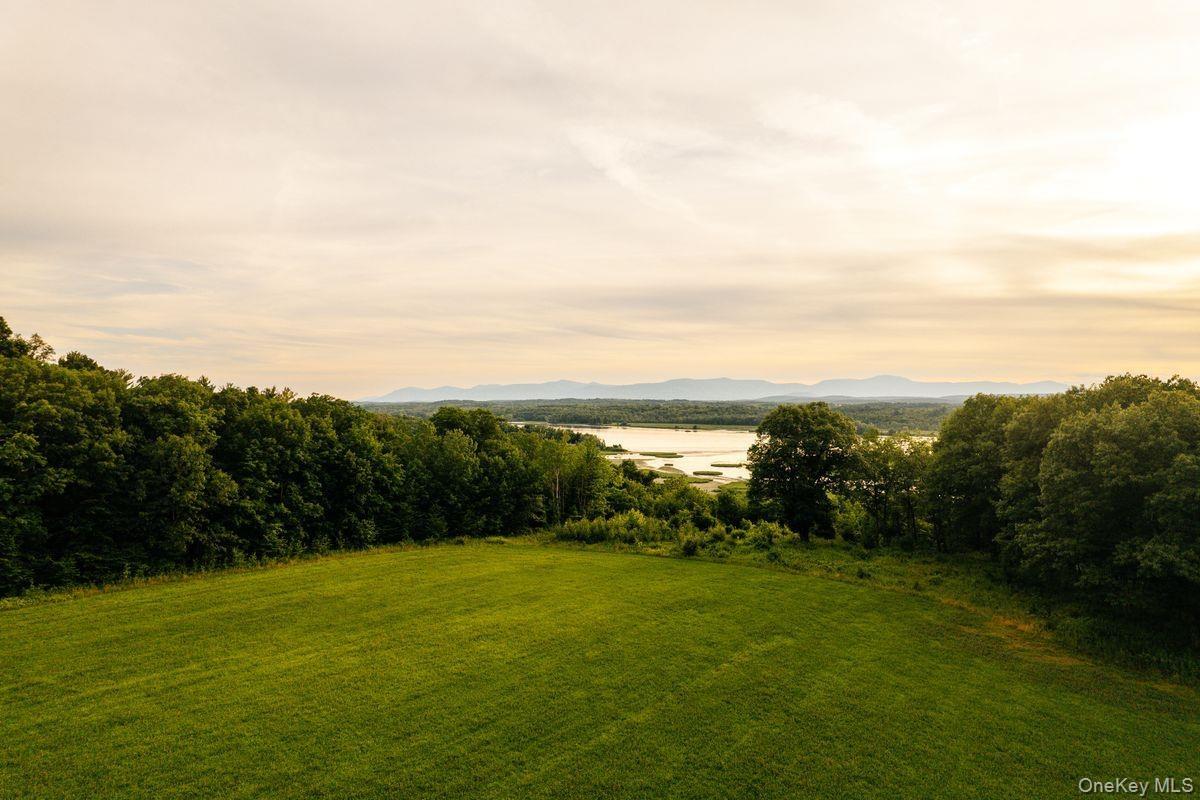 View of yard featuring a water and mountain view