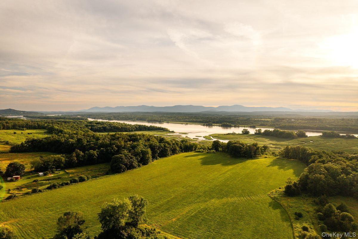 Bird's eye view with a rural view and a water and mountain view