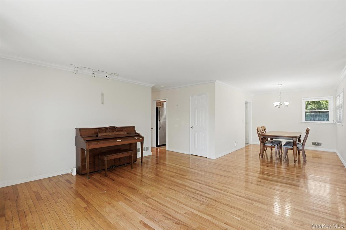 Living room/dining room combination situated off kitchen area.