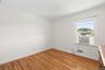 Bedroom 1 with window air conditioner.