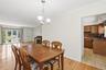Living room has large picture window allowing for bright morning sunlight.