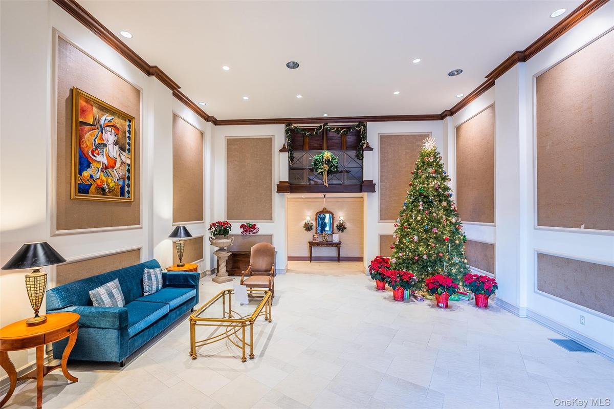 Common area with recessed lighting and crown molding