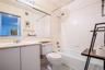 Bathroom featuring shower / bathtub combination, vanity, and tile patterned floors