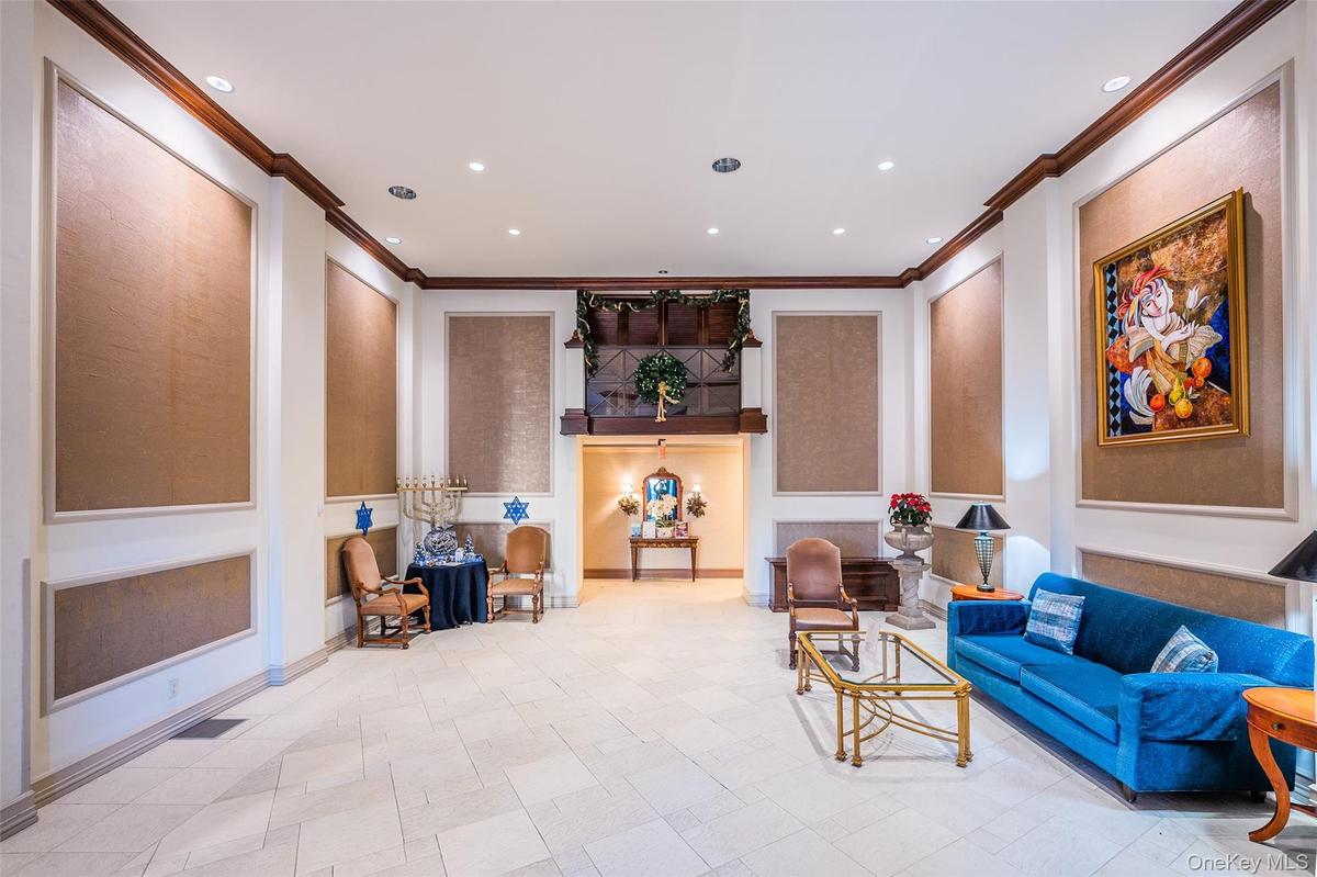 Community lobby with crown molding and recessed lighting