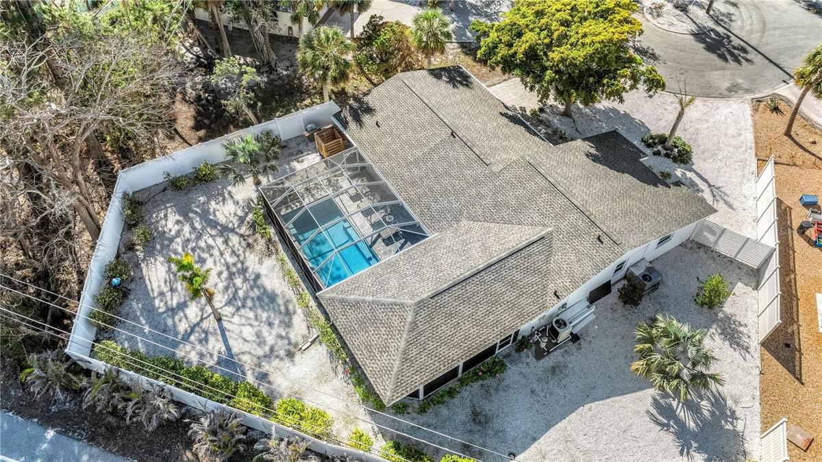 Aerial of home and large fenced in lot