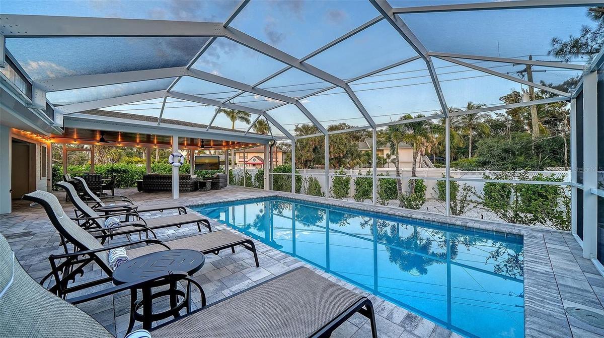 Beautiful pool area with screened lanai