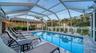 Beautiful pool area with screened lanai