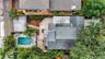 An overhead view shows the home’s layout, pool, deck, mature landscaping, and rear parking area.