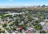 Aerial views highlight the home’s exceptional location near Crescent Lake Park, with downtown St. Petersburg and the waterfront just beyond.