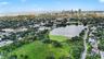 Crescent Lake Park’s scenic waterfront, walking paths, and expansive green space are close by, with downtown St. Petersburg rising in the distance.