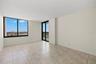 Primary bedroom with balcony access