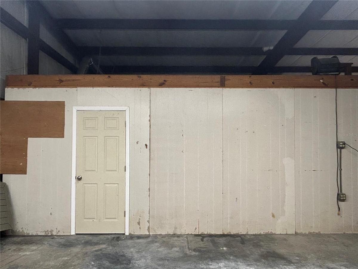 Door to bathroom with second door into office. Office also has another entry door across from loft