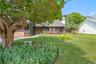 The lush and mature landscaping highlight the front of the home as well.