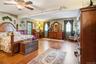 The expanded primary bedroom suite easily accommodates oversized furniture, while still offering plenty of additional living space.