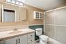 Off the top of the staircase is the 3rd bathroom, with a walk-in shower stall.