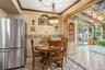 Exit the kitchen into the expansive sun room.