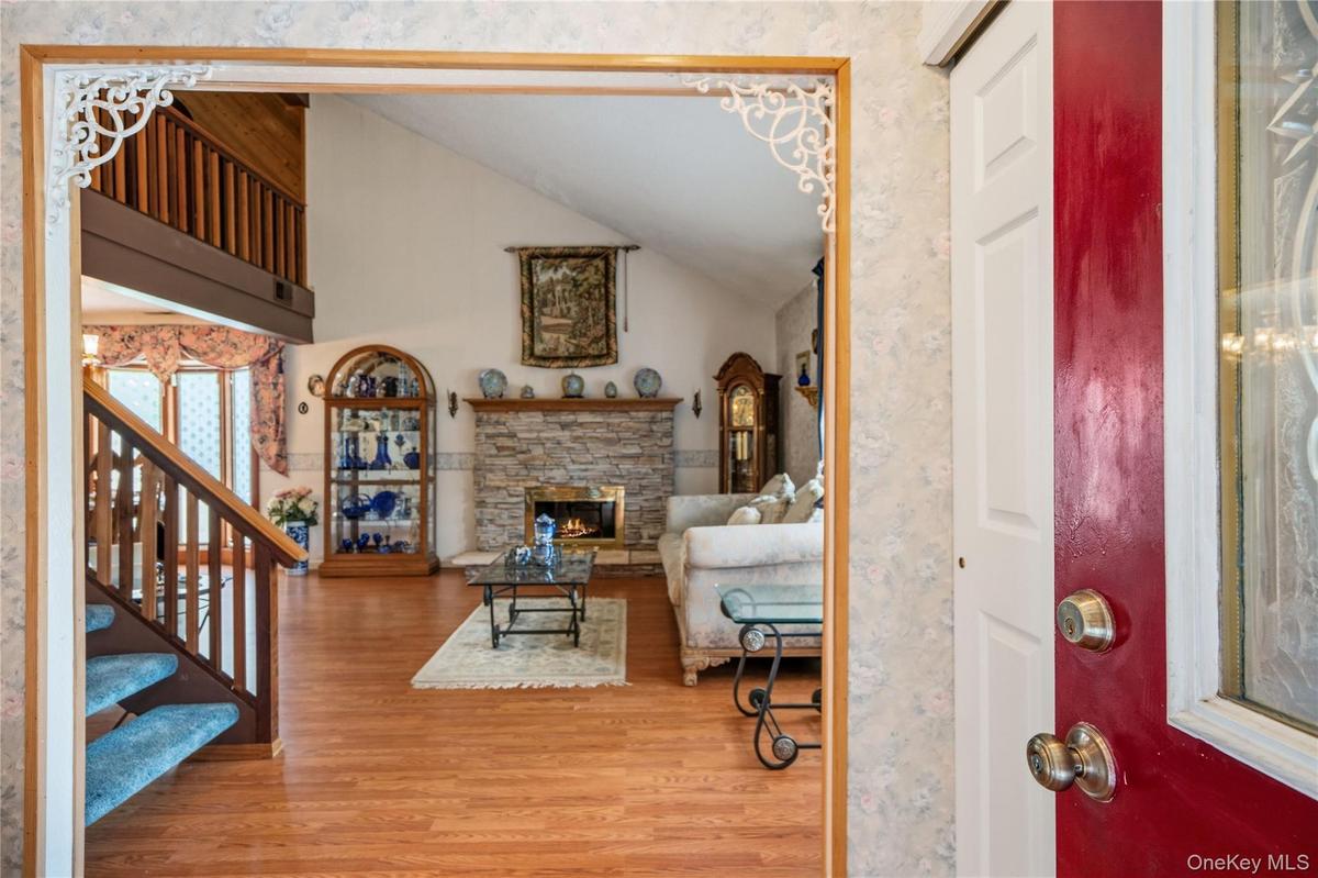 Walk in from under the covered entryway and into the entrance foyer with a large coat closet.