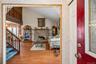 Walk in from under the covered entryway and into the entrance foyer with a large coat closet.