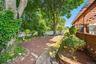 The pergola covered deck provides the perfect outdoor escape to entertain or relax while looking out to the peaceful & serene setting of the backyard.