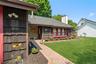 The paver-stone walkway leads you off the doublewide driveway and to your front door.