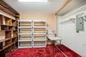 Off the primary bedroom is an addition built into the garage, which was used as a sewing/craft room, but can easily be utilized as a walk-in closet, h