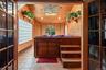 Enter off the primary bedroom and unwind in your own private retreat.  The warm natural wood walls & ceiling of the hot tub room create a cozy atmosph
