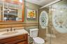 The ensuite bathroom has a full walk-in stall shower.