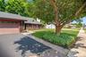 The home has a brand new roof and there is plenty of parking on the asphalt driveway.  Enjoy experiencing the neighborhood on your sidewalk lined stre