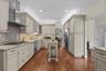 Another view of kitchen with breakfast bar