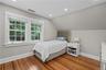 Bedroom with custom closet and built-ins.