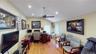 Room featuring wood-finish flooring, a vaulted ceiling, recessed lighting, and a ceiling fan