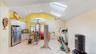 Vaulted ceiling with dual skylights and ceiling fan